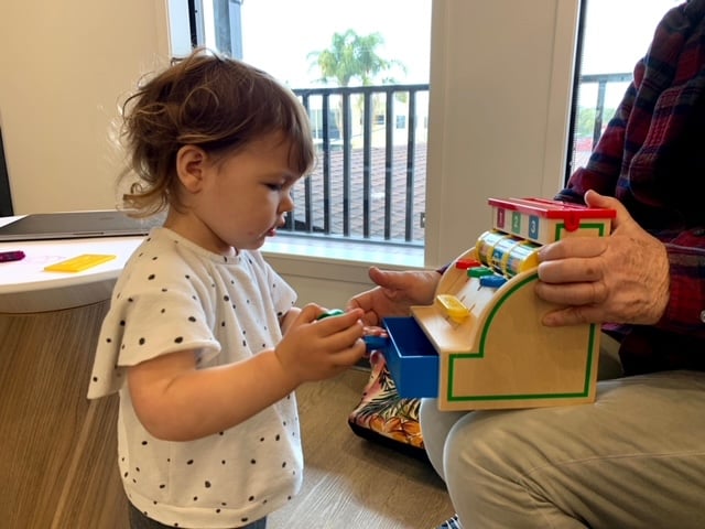 toddler playing with toy