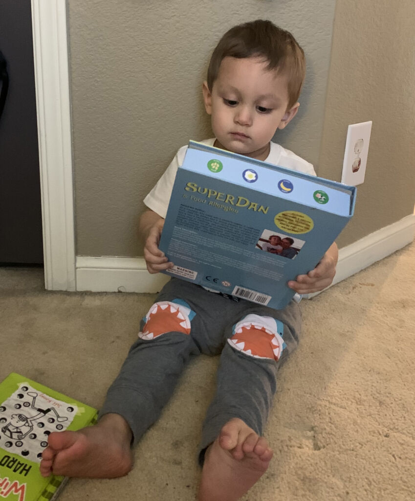 Jens son reading food allergy book